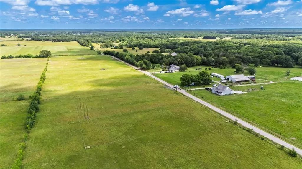 Aerial view of open land and rural homesites in East Texas